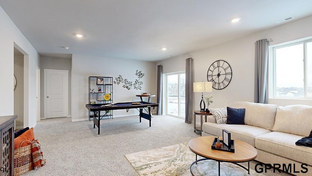 living room featuring light carpet