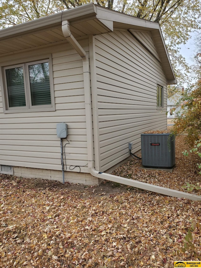 view of side of property with central AC