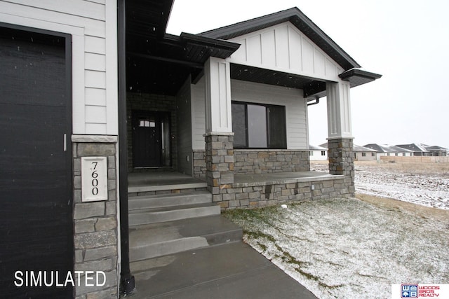 entrance to property with a porch