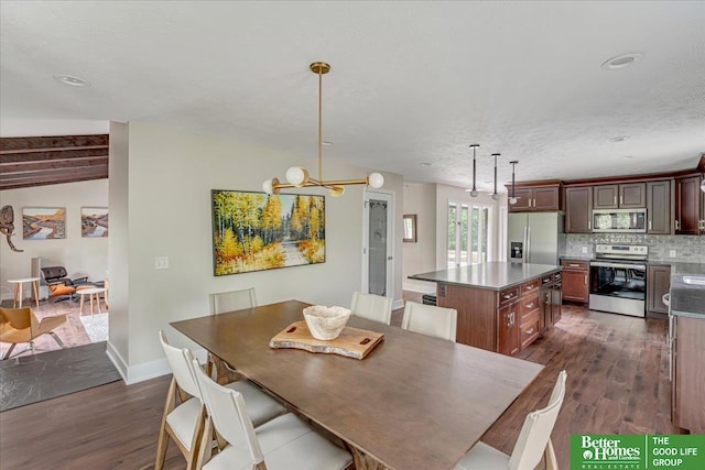 dining area featuring a textured ceiling and dark hardwood / wood-style flooring