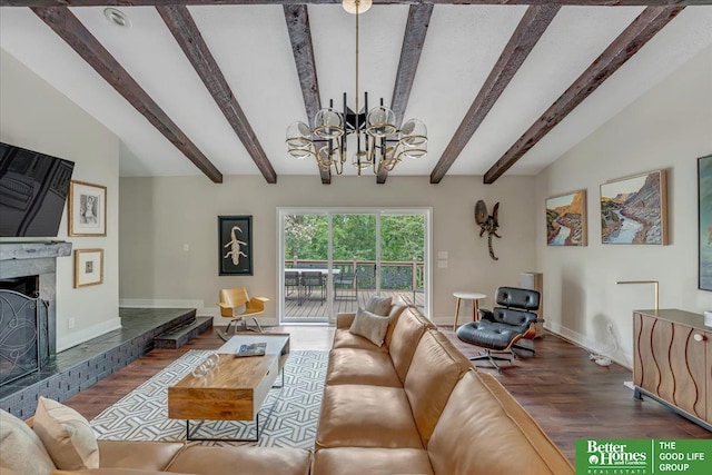 living room featuring an inviting chandelier, lofted ceiling with beams, wood-type flooring, and a fireplace