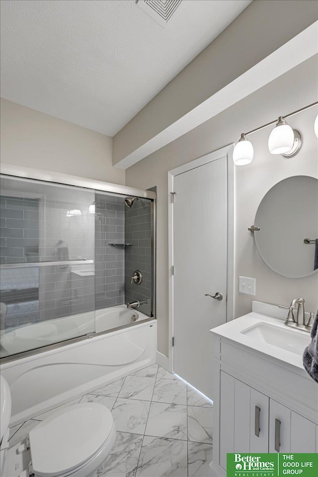 full bathroom featuring vanity, bath / shower combo with glass door, a textured ceiling, and toilet