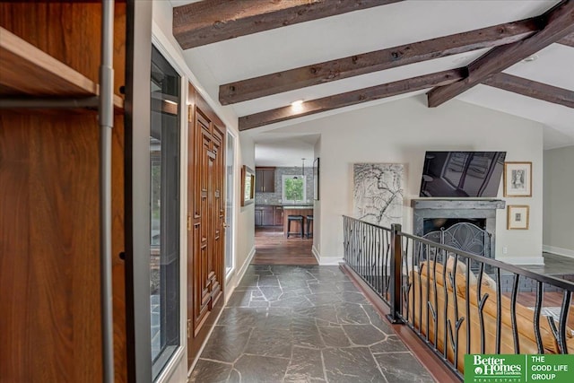 hall with dark wood-type flooring and lofted ceiling with beams