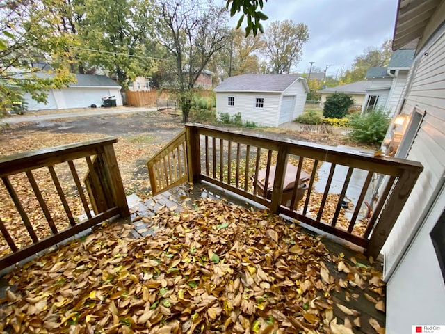 wooden deck featuring an outbuilding