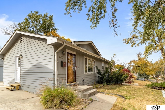 view of front of home with a front yard