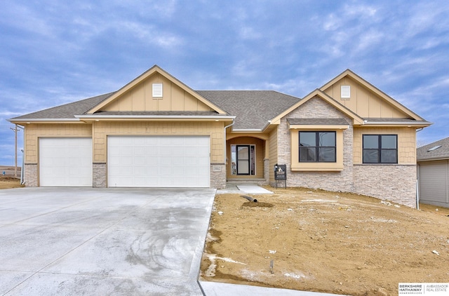 craftsman inspired home with a garage