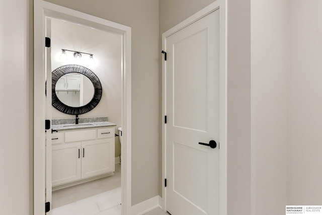 bathroom with tile patterned flooring and vanity