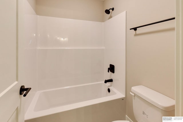 bathroom with toilet and washtub / shower combination