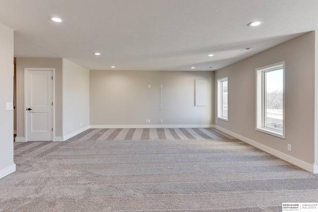 empty room with light colored carpet