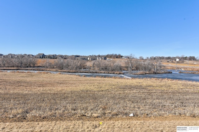 view of yard with a rural view