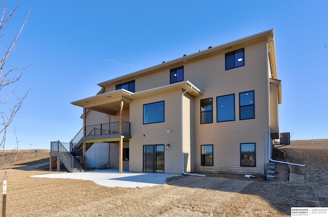 rear view of house with a patio