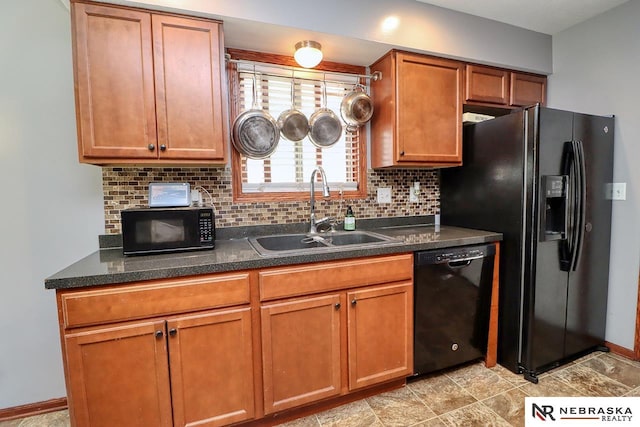 kitchen featuring tasteful backsplash, black appliances, and sink