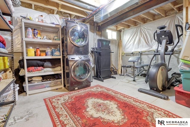 laundry room with stacked washer and clothes dryer