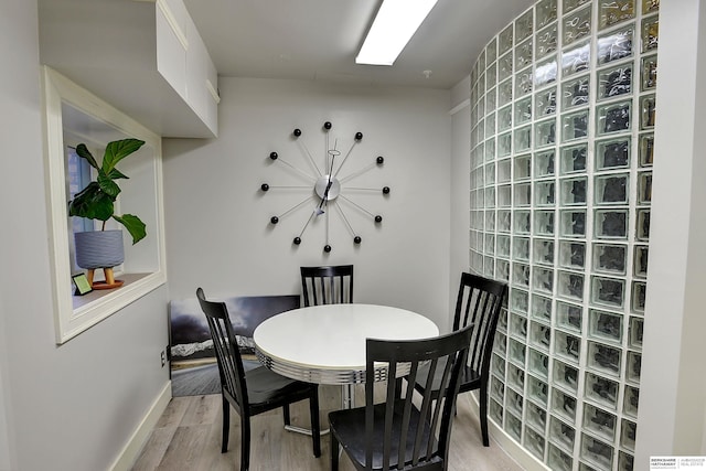 dining room with hardwood / wood-style flooring