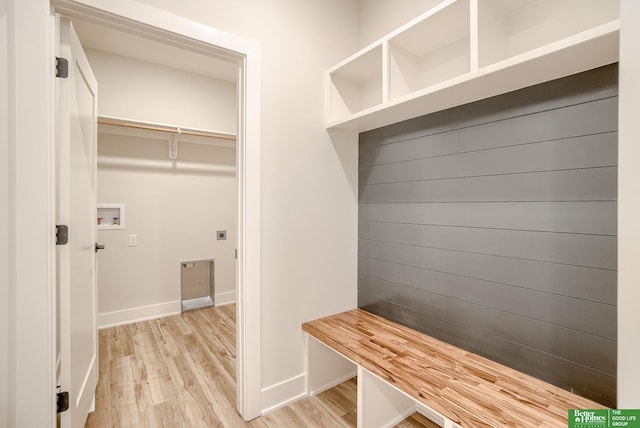 mudroom with light hardwood / wood-style floors