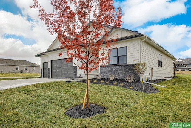 ranch-style house with a front yard and a garage