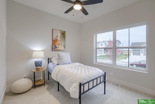 carpeted bedroom featuring ceiling fan