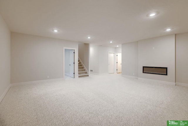 basement featuring light carpet