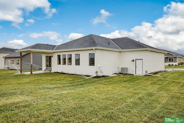 back of property featuring a patio area, central AC, and a lawn