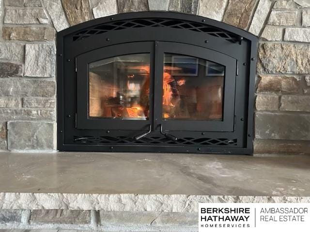 details with a fireplace and concrete floors