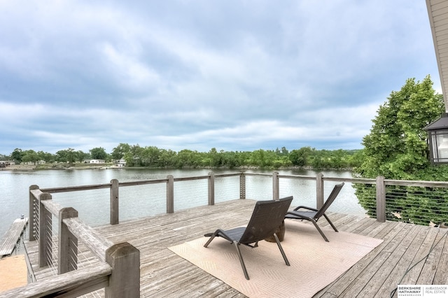 view of dock with a deck with water view