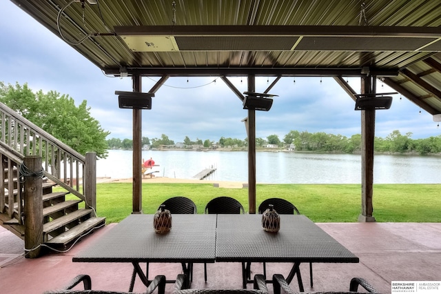 view of patio with a water view