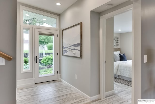 entryway with a wealth of natural light and light hardwood / wood-style floors