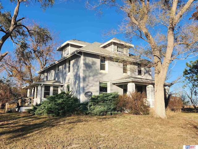 view of home's exterior with a yard