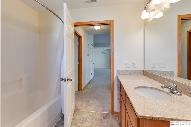 bathroom with vanity and shower / bath combination with curtain