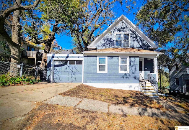 view of front of home with a porch and a garage