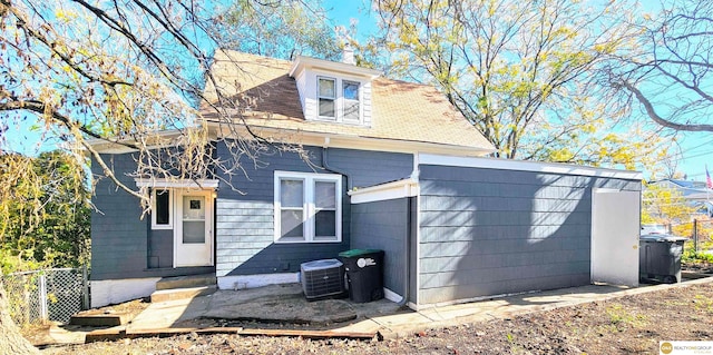 view of front of property with cooling unit