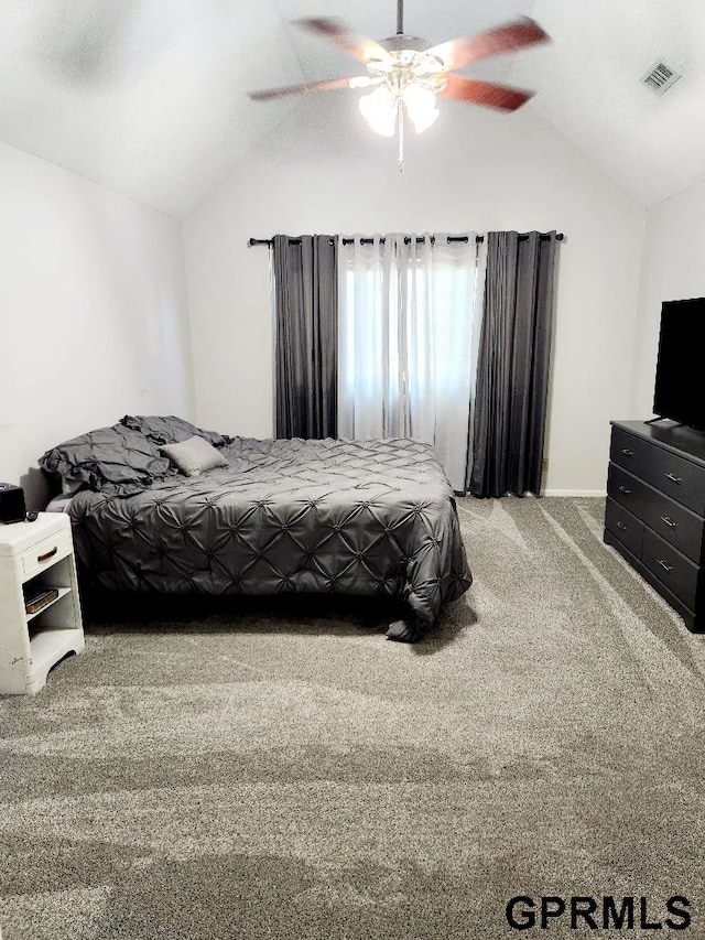 bedroom with vaulted ceiling, carpet flooring, and ceiling fan