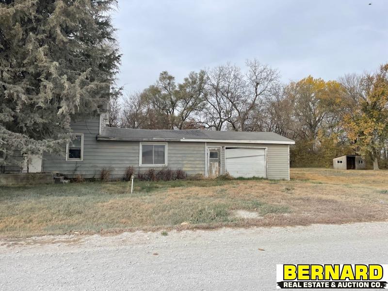 view of front of home featuring an outbuilding and a garage