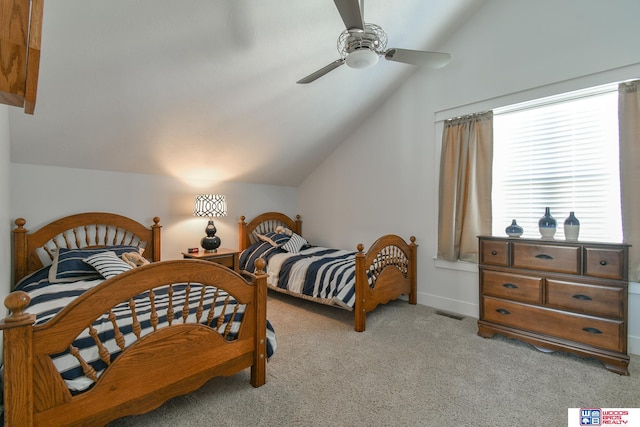 carpeted bedroom with lofted ceiling and ceiling fan