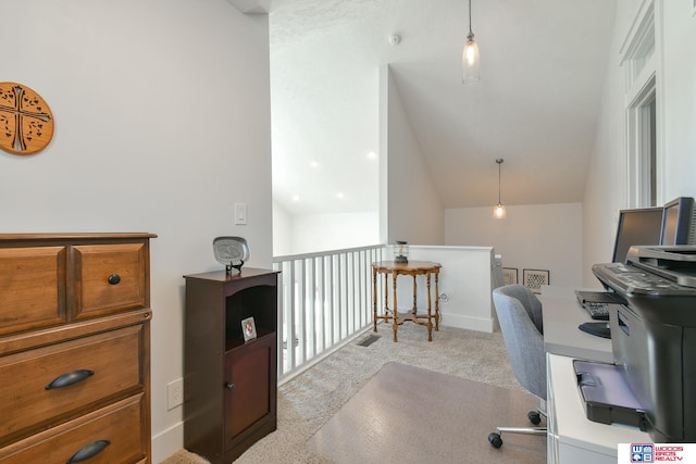 carpeted office with vaulted ceiling