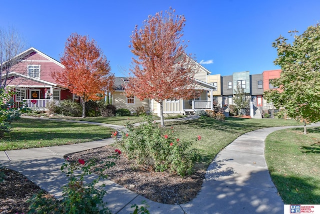 view of property's community featuring a yard