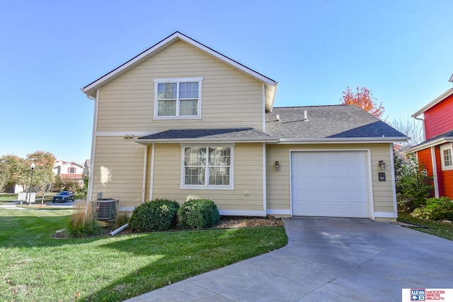 view of front property with a front lawn and a garage