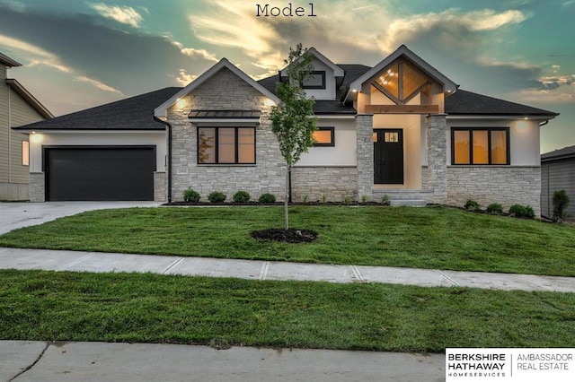 3902 S 212th St, Omaha, NE 68022 - view of front of home featuring stone siding, stucco siding, an attached garage, driveway, and a yard
