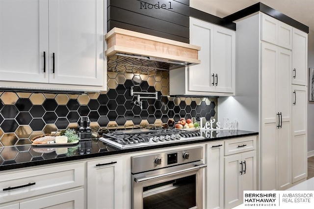 3902 S 212th St, Omaha, NE 68022 - kitchen with appliances with stainless steel finishes, white cabinets, dark countertops, and tasteful backsplash