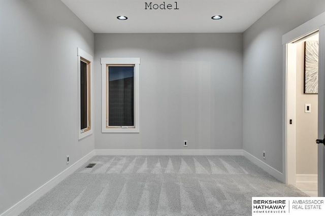 3902 S 212th St, Omaha, NE 68022 - unfurnished room featuring light colored carpet, baseboards, and recessed lighting