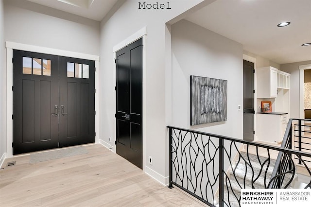 3902 S 212th St, Omaha, NE 68022 - entryway with baseboards, light wood-style floors, and recessed lighting