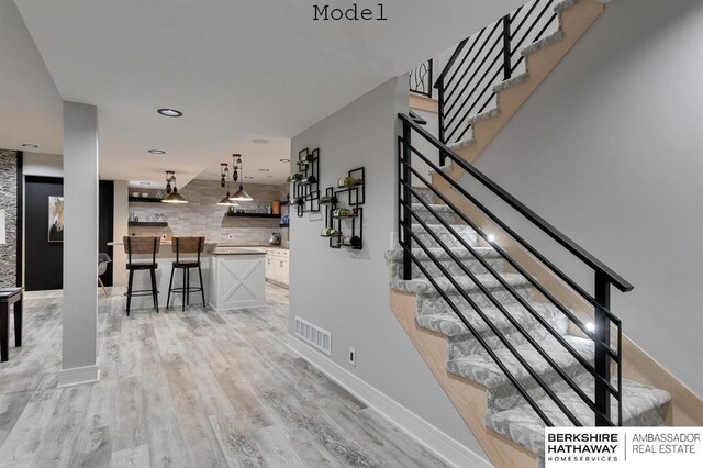 3902 S 212th St, Omaha, NE 68022 - stairs featuring wood finished floors and baseboards