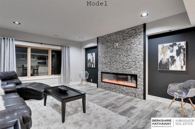 3902 S 212th St, Omaha, NE 68022 - living area with a fireplace, wood finished floors, baseboards, and recessed lighting