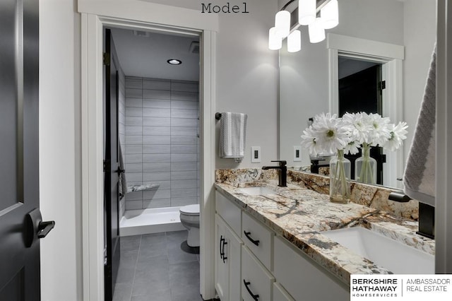 3902 S 212th St, Omaha, NE 68022 - full bath featuring toilet, double vanity, tile patterned floors, and a stall shower