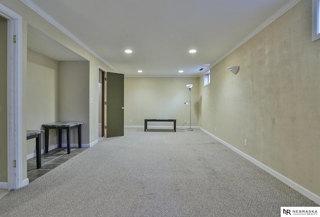 basement featuring ornamental molding and carpet floors