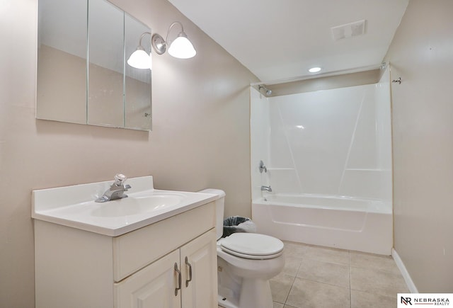 full bathroom featuring vanity, washtub / shower combination, tile patterned floors, and toilet