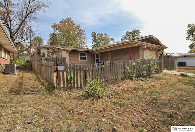 view of home's exterior with central AC