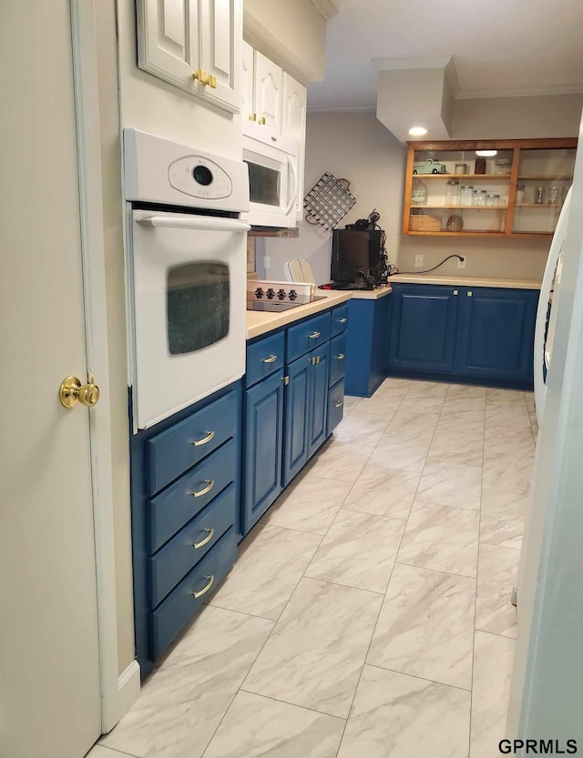 kitchen with blue cabinets, white cabinetry, ornamental molding, and white appliances