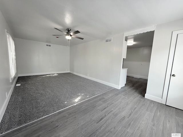 unfurnished room featuring hardwood / wood-style flooring and ceiling fan