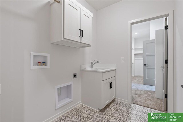 washroom featuring washer hookup, cabinets, sink, electric dryer hookup, and light colored carpet